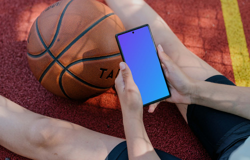 Basketball player checking on a Google Pixel mockup