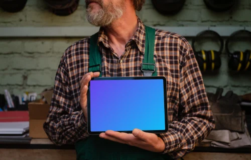 Crafter holding an iPad Air mockup