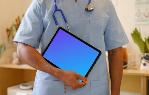 Doctor’s hand holding an iPad mockup