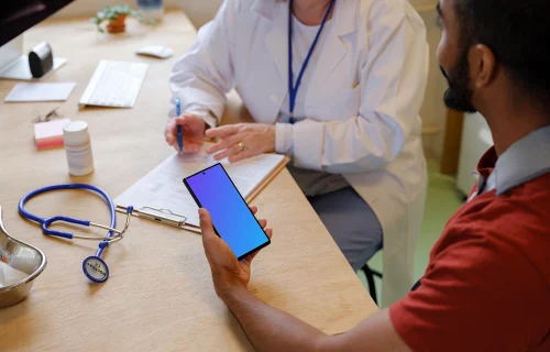 Examination at the doctor and patient holding a phone