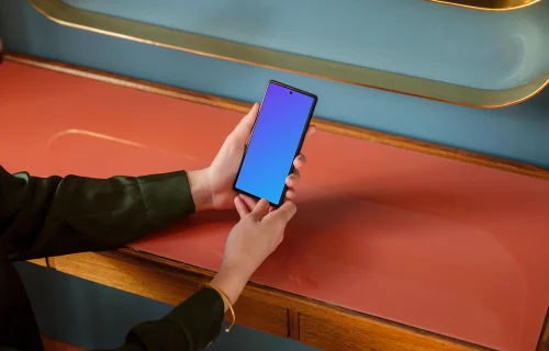 Female holding a Google Pixel mockup in the office