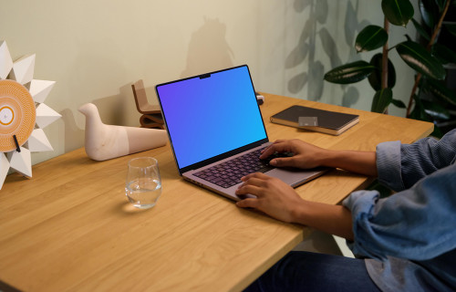 Hands typing on a MacBook Pro 14 mockup