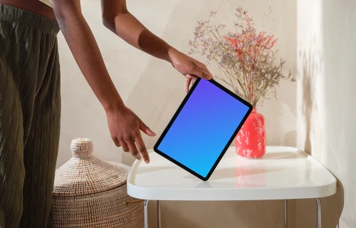 iPad Air mockup with female hand on a modern white table