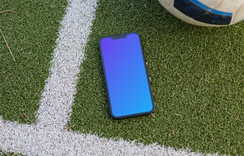 iPhone 13 mockup on the grass