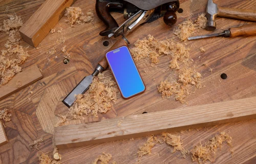 iPhone 14 Pro surrounded by carpentry tools