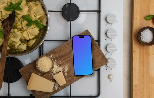 iPhone on wooden cutting board with cheese