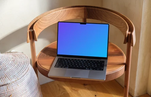 MacBook Pro mockup on a round wooden table