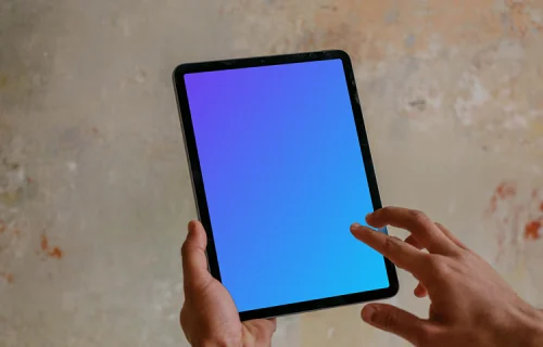 mockup gratuit d'un homme pointant sur l'iPad