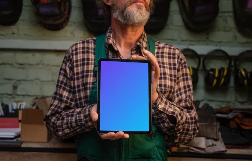 Mechanic holding an iPad mockup