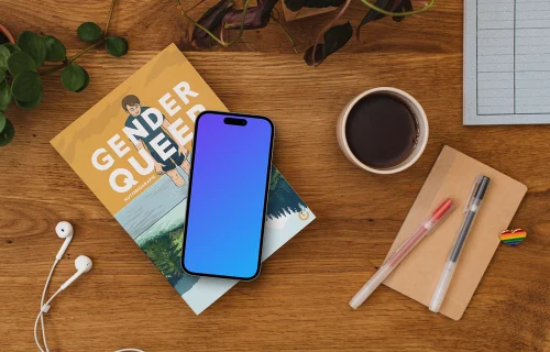Smartphone mockup on a wooden table with rainbow heart pin
