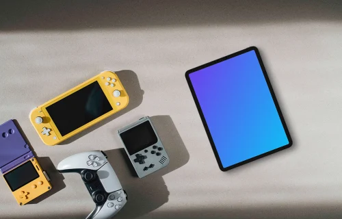 Tablet mockup with gaming consoles on a neutral background