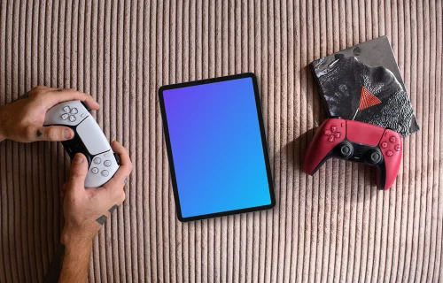 Tablet mockup with gaming controllers on textured background