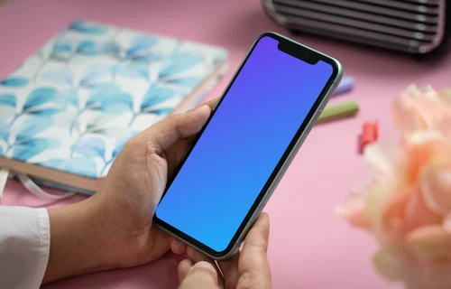 User holding an iPhone 11 mockup