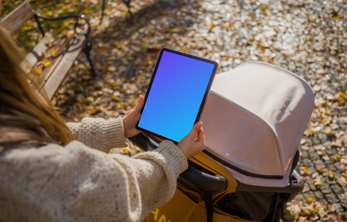 Woman hands holding an iPad Air in autumn season mockup