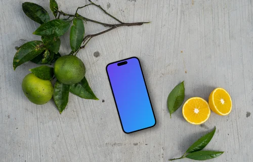 Smartphone mockup on a table with citrus fruits