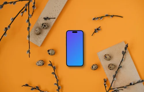 Smartphone mockup with Easter theme on an orange table