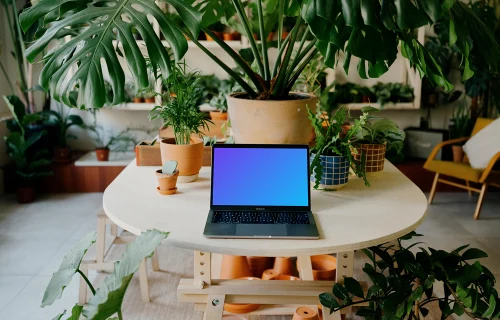 MacBook Pro mockup amidst an indoor garden