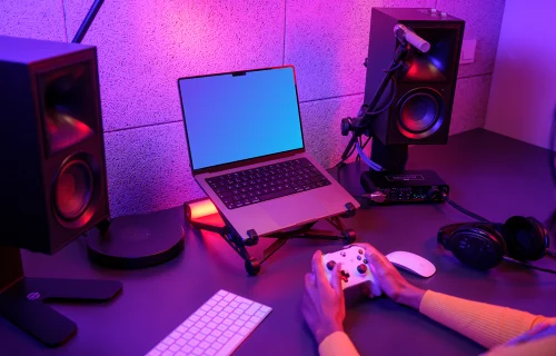 MacBook Pro mockup in a neon-lit gaming setup