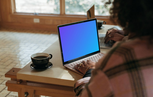 Microsoft Surface laptop mockup being used by a lady