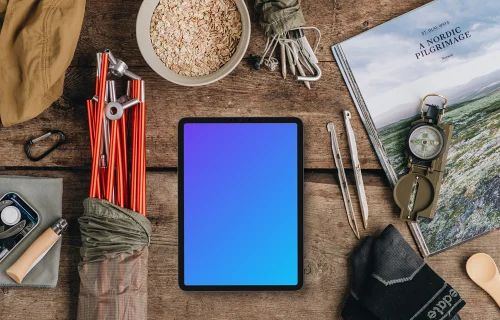 Tablet mockup with outdoor hike supplies