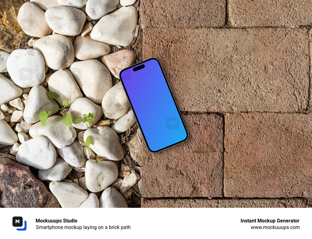 Smartphone mockup laying on a brick path