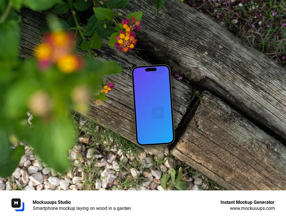 Smartphone mockup laying on wood in a garden