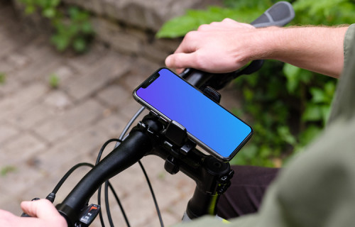 Debout sur un vélo avec un iPhone 11 Pro mockup dans un support de vélo