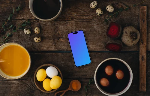 Coloriage d'œufs de Pâques à côté d'un smartphone mockup