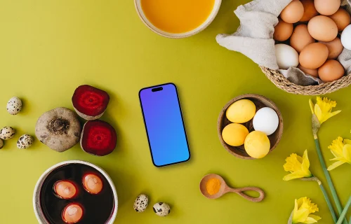 Easter eggs being colored around a smartphone mockup