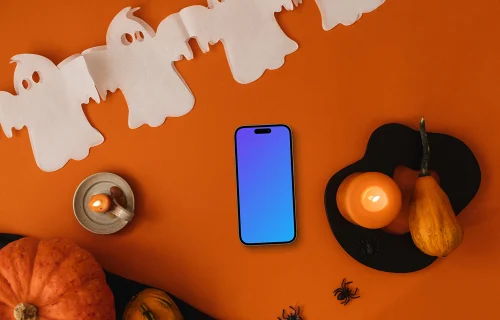 Fond d'écran d'Halloween mockup avec un téléphone et une citrouille