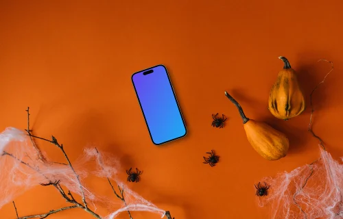 Fond d'écran d'Halloween mockup avec un smartphone et des araignées