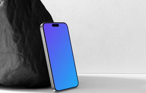 iPhone 15 Pro Leaning Against a Rock Mockup