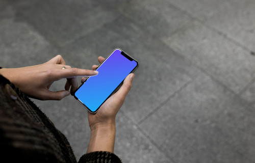 Pointing on iPhone X mockup in the underground
