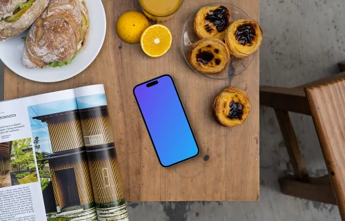 Smartphone mockup in a cafe with pastries