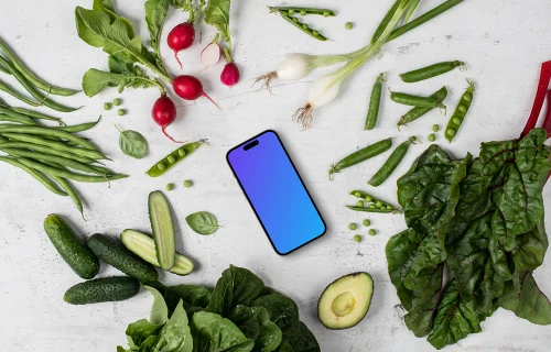 Smartphone mockup in the middle of vegetables
