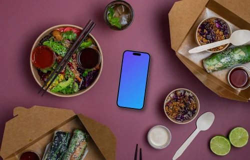 Smartphone mockup entouré de nourriture asiatique