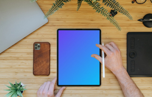 Tablet mockup on a wooden table with iPhone 11 at the side
