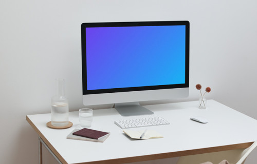 Configuration de l'espace de travail iMac mockup avec bureau et chaise