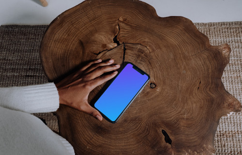 iPhone mockup sur une table en bois